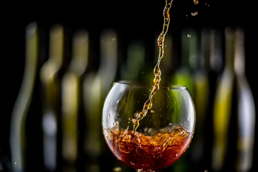 glasses and bottles for brandy and wine in the background