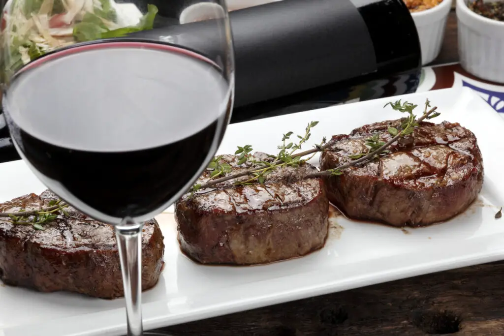 Three steaks roasted on the grill