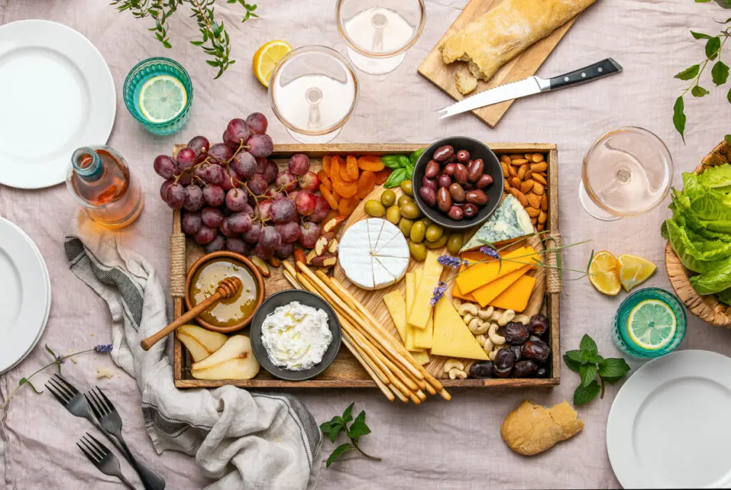 Cheese platter for summer outdoor party, top down view