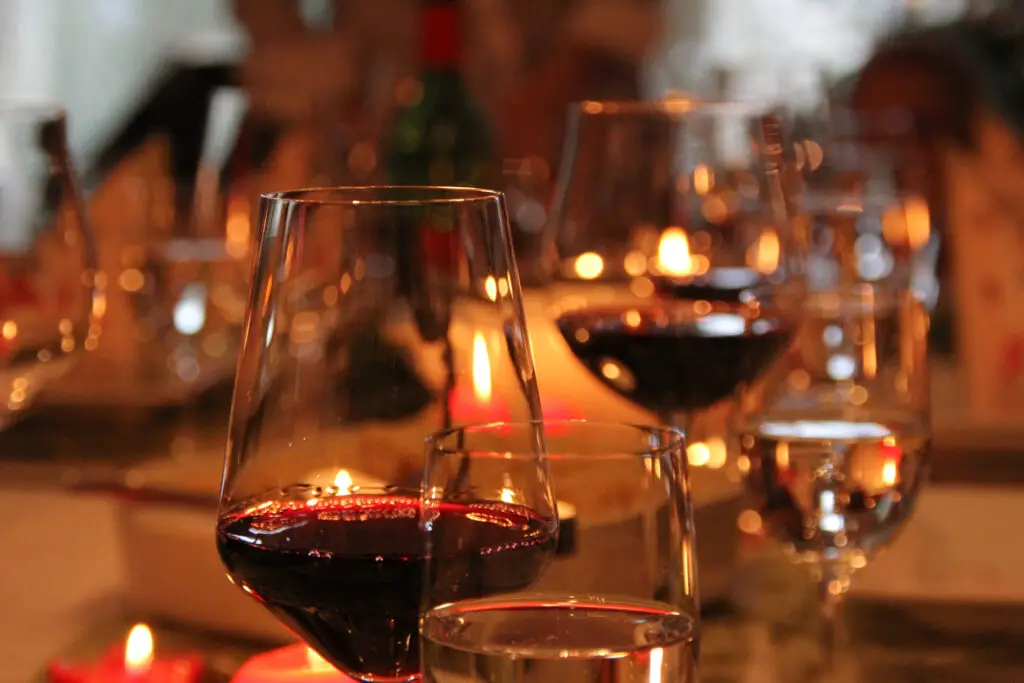 Festive Christmas decoration with red wine in wine glasses on a table in Fulda, Germany.