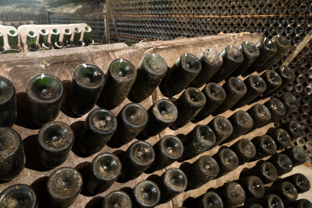 wine glass  bottles fermenting  in winery cellar