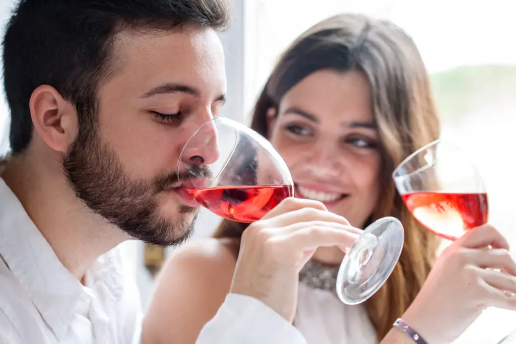 Couple enjoying wine tasting.