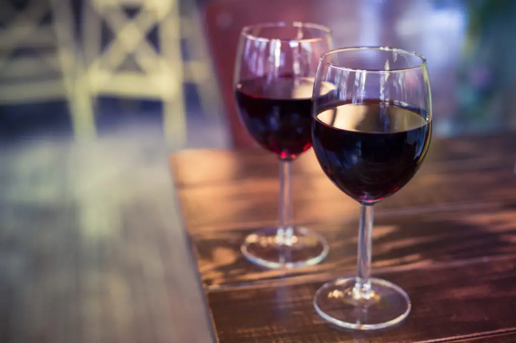 Wine glasses on the background of the bar