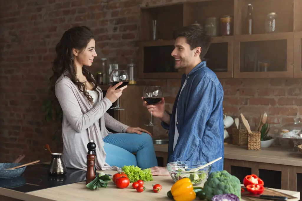 Happy couple cooking healthy food together