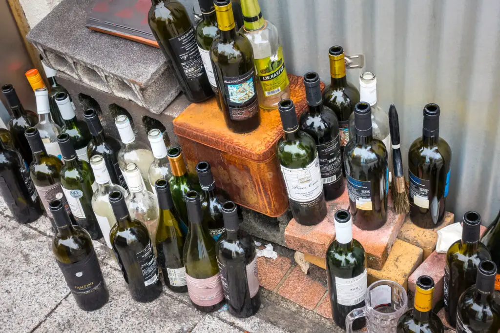 set of empty glass bottles of alcoholic beverages