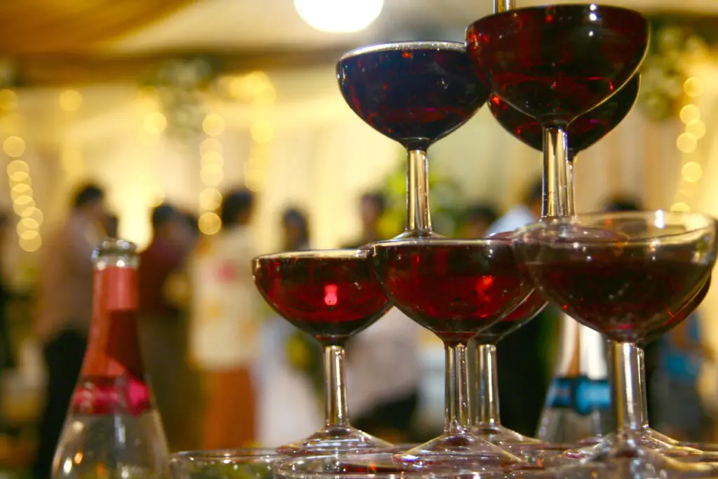 Stacked wine glasses like pyramid tower