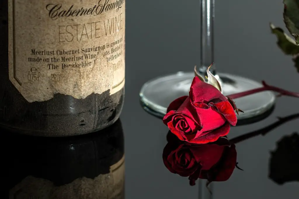 the most expensive wines in 2024 with a rose on a black countertop
